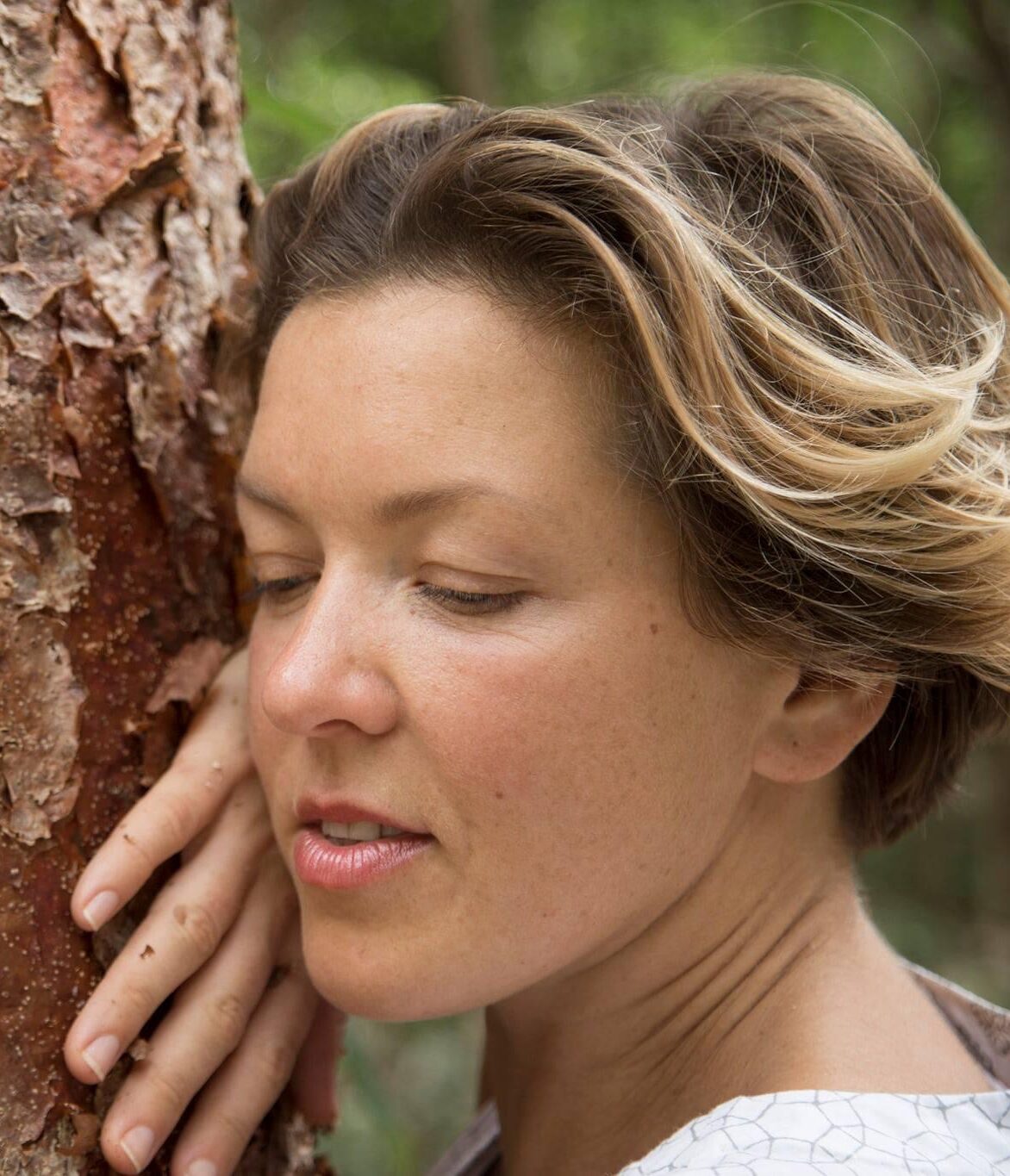 Portrait of Ksenya Egorova hugging a tree